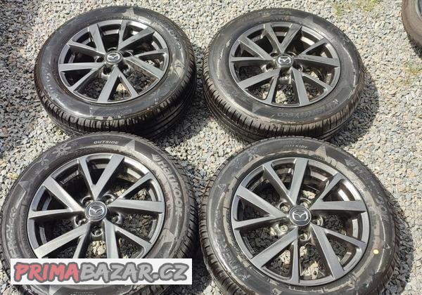 Zánovní letní ALU Mazda 16
